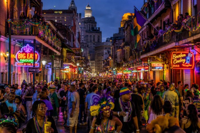 Bourbon Street lit up at night during Carnival